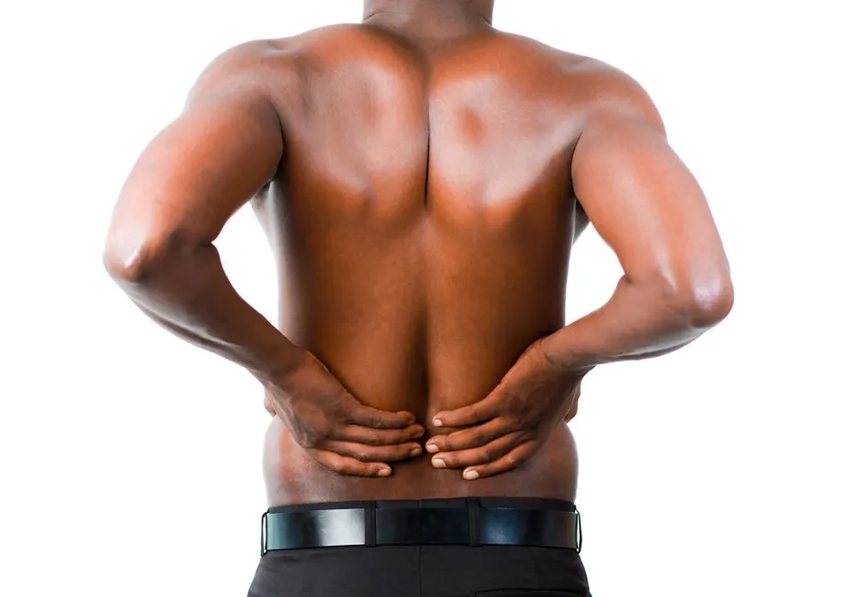 Person holding their lower back