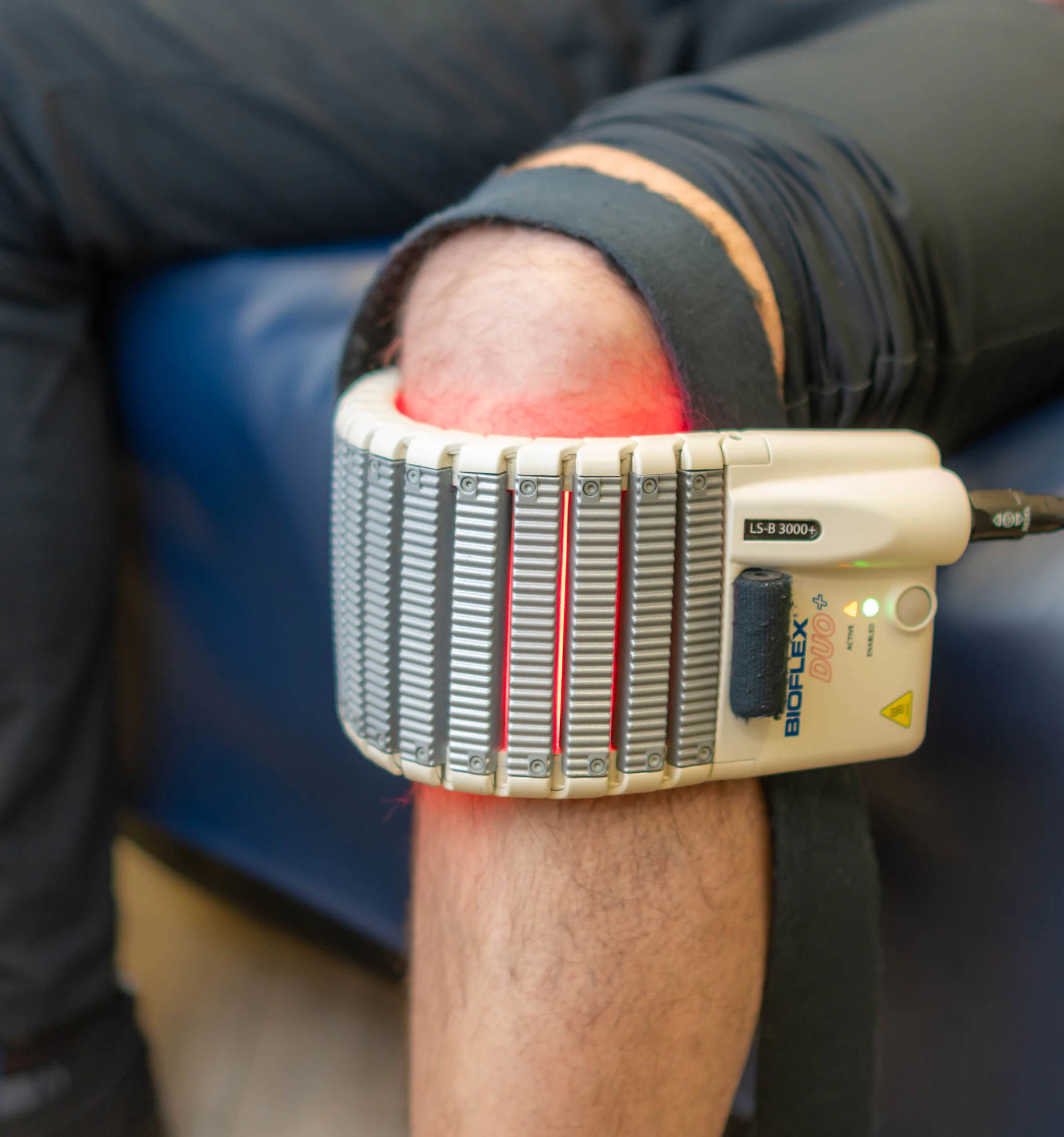 Low-level cold laser therapy array treating a patient’s knee
