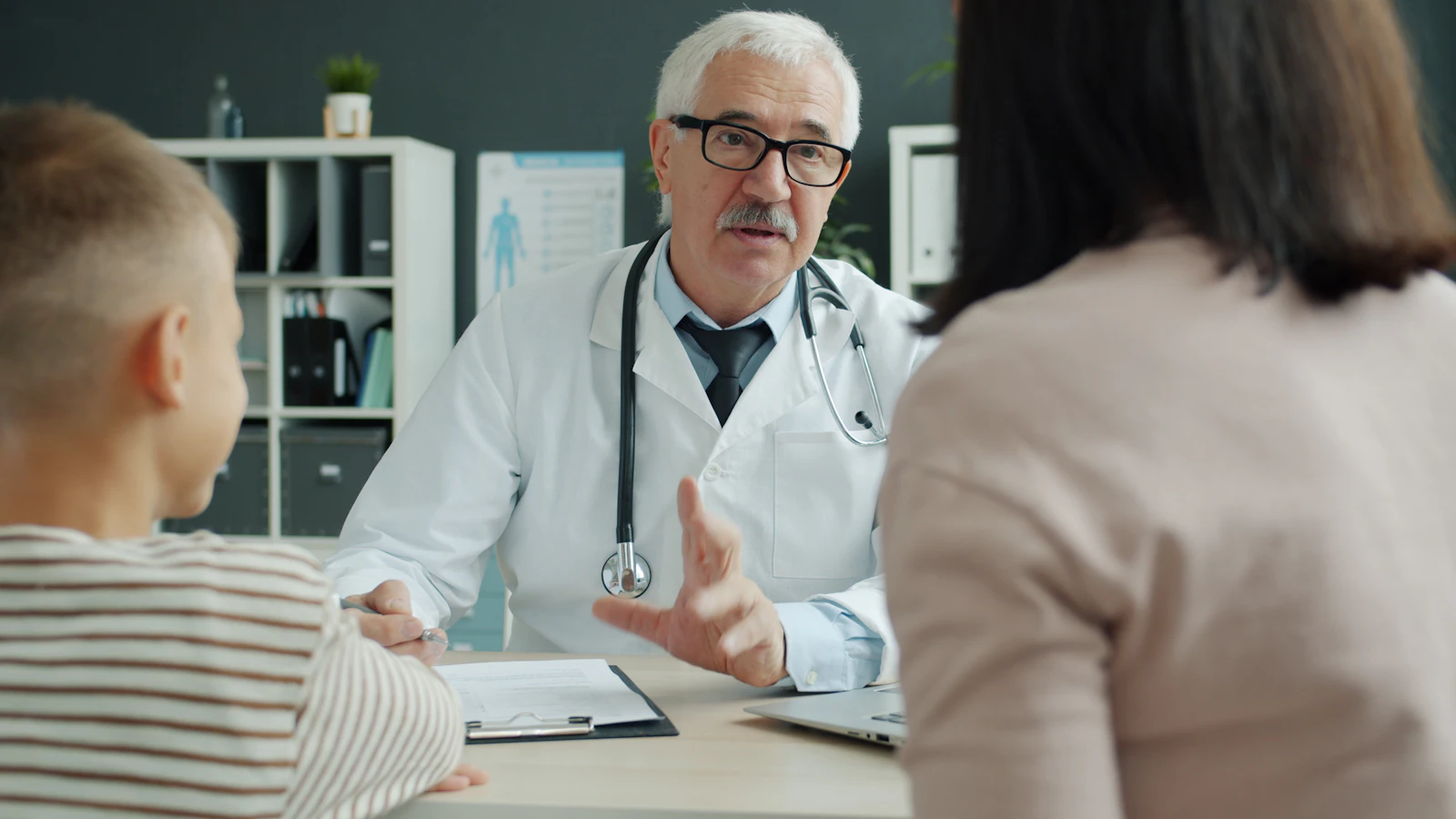 Doctor answering a parent’s questions during a pediatric visit